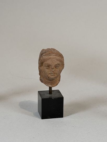 Set of three heads, including one grotesque...