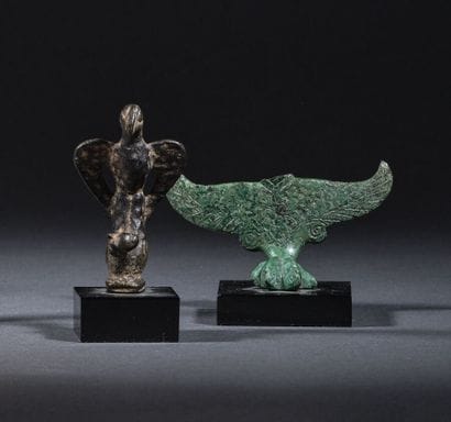 Statuette of an eagle resting on a stylized...