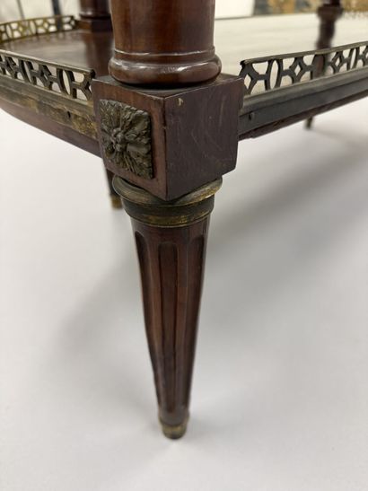 A pair of half-moon-shaped mahogany console...