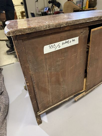 A rosewood chest of drawers with a curvilinear...