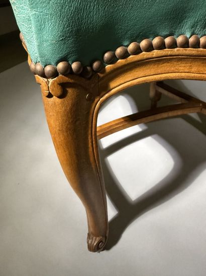 Four chairs in molded and carved beech, with...