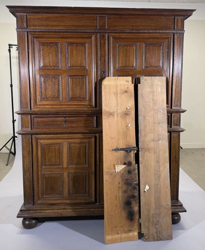 Two-section walnut cabinet with four-panel...