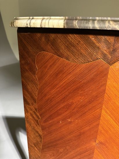 A rosewood and palisander chest of drawers...