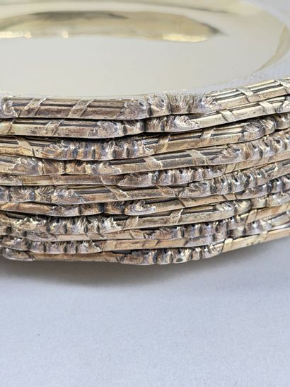 Set of twenty-four multi-lobed vermeil plates...