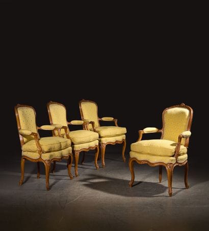 A set of four cabriolet armchairs in natural...