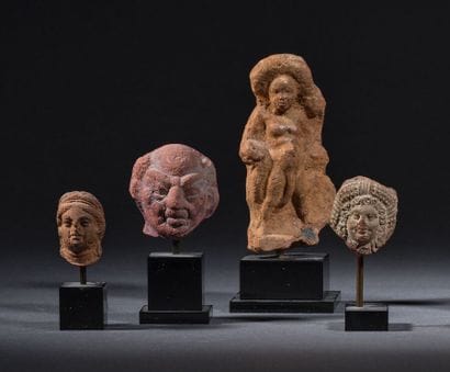Set of three heads, including one grotesque...