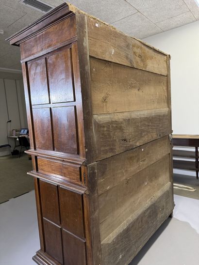 Two-section walnut cabinet with four-panel...