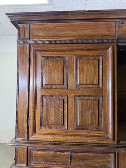 Two-section walnut cabinet with four-panel...