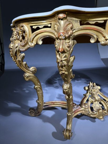 Carved and gilded wooden console table, resting...