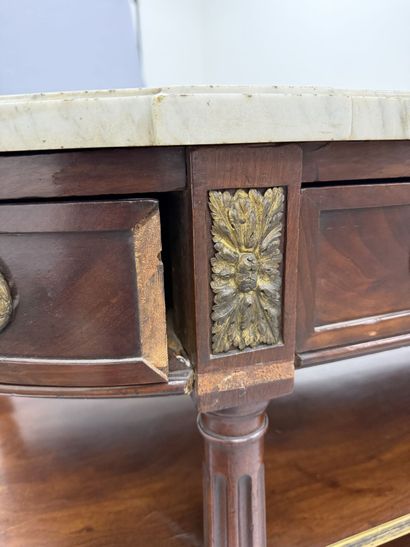 A pair of half-moon-shaped mahogany console...