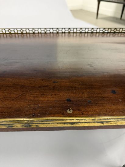 A pair of half-moon-shaped mahogany console...