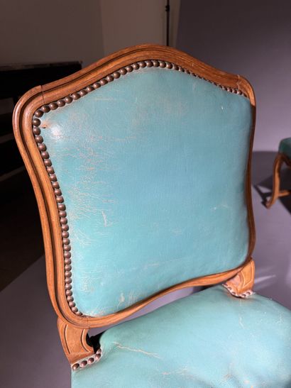 Four chairs in molded and carved beech, with...