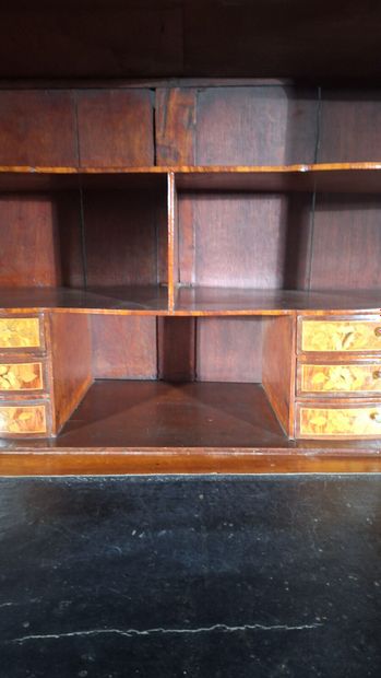 Wood veneer secretary desk opening via a...