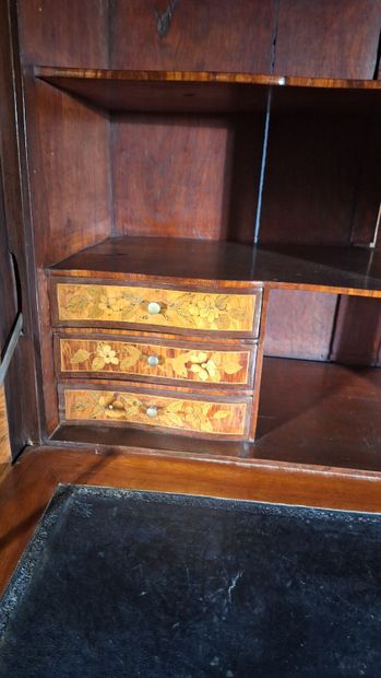 Wood veneer secretary desk opening via a...