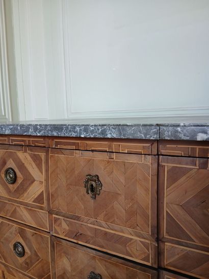 Center-recessed veneered wood chest of drawers...