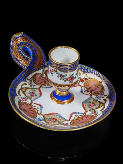 SÈVRES
Soft-paste porcelain hand-held candlestick...