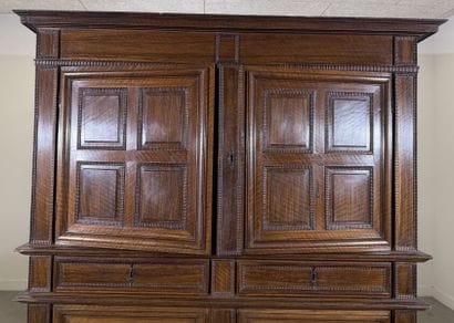 Two-section walnut cabinet with four-panel...