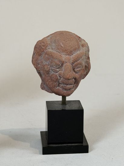 Set of three heads, including one grotesque...