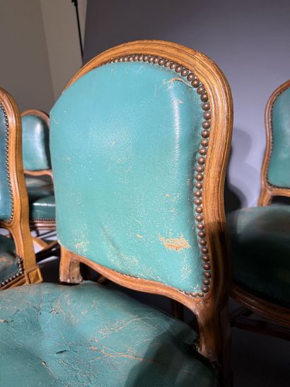 Ten chairs in molded beech with rounded backs,...