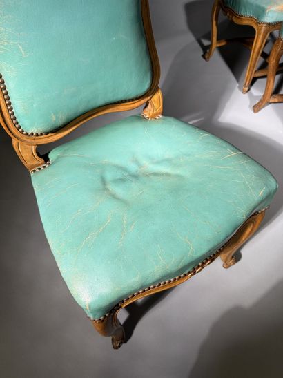 Four chairs in molded and carved beech, with...