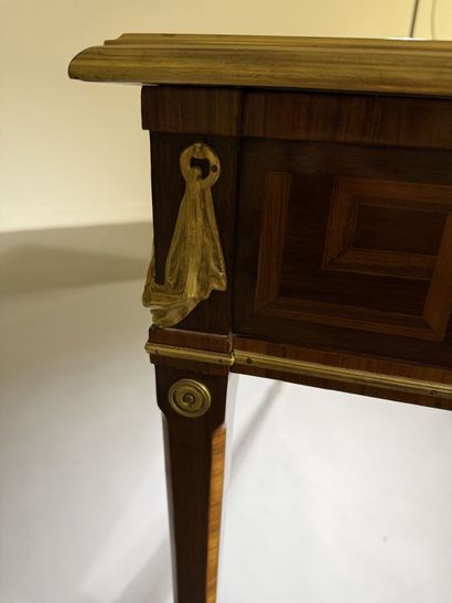 A small, flat desk made of rosewood and amaranth,...