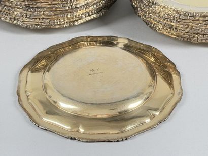 Set of twenty-four multi-lobed vermeil plates...