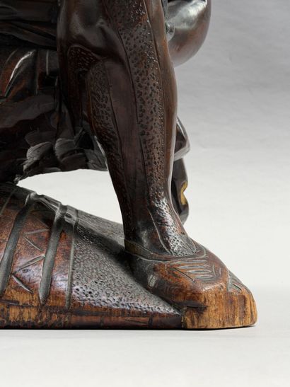 Rectangular, stained wooden stool with a...