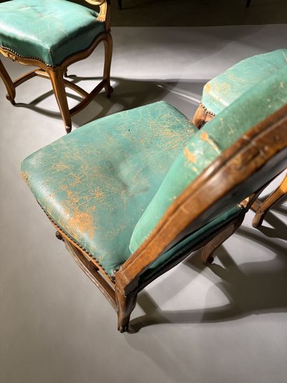Four chairs in molded and carved beech, with...