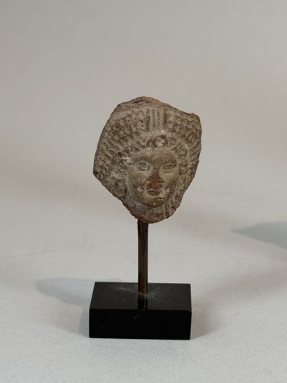 Set of three heads, including one grotesque...