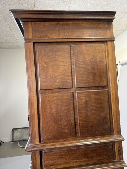 Two-section walnut cabinet with four-panel...