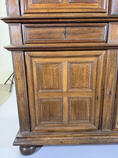 Two-section walnut cabinet with four-panel...