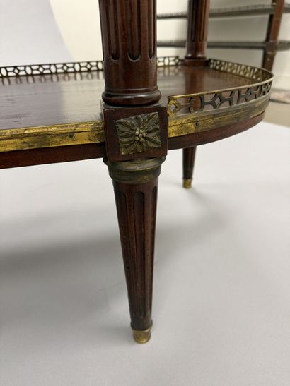 A pair of half-moon-shaped mahogany console...