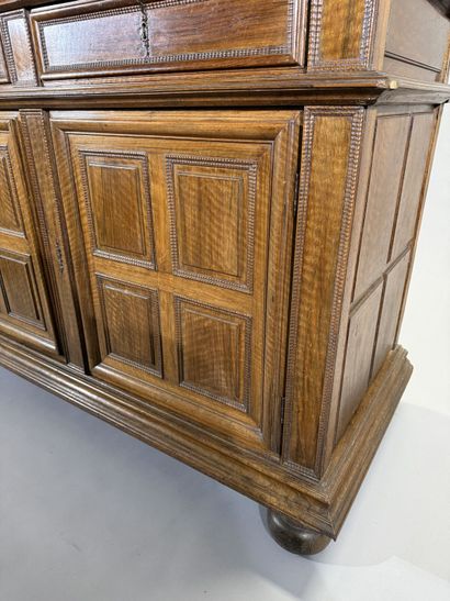 Two-section walnut cabinet with four-panel...