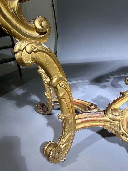 Carved and gilded wooden console table, resting...