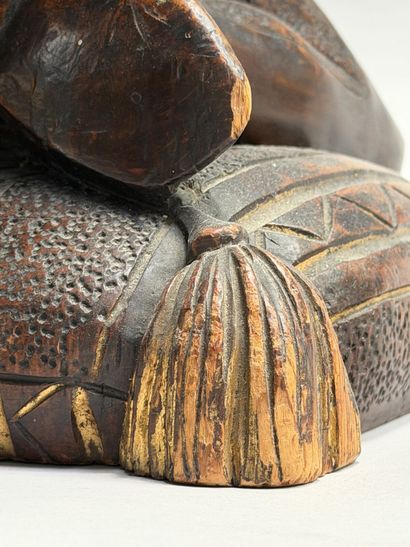 Rectangular, stained wooden stool with a...