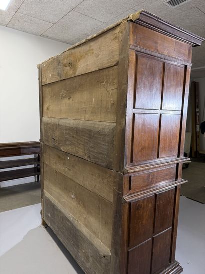 Two-section walnut cabinet with four-panel...