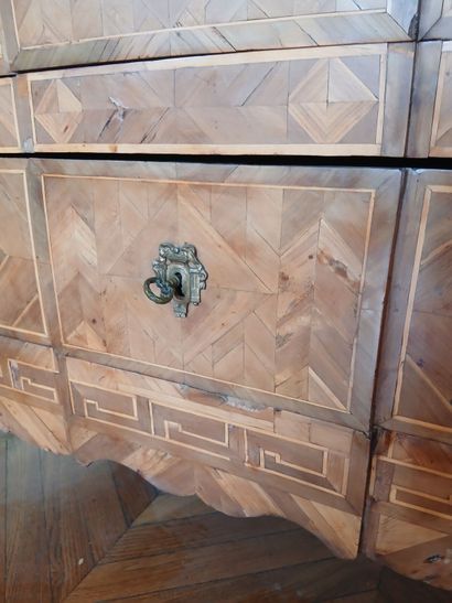 Center-recessed veneered wood chest of drawers...