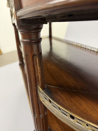 A pair of half-moon-shaped mahogany console...