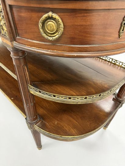 A pair of half-moon-shaped mahogany console...