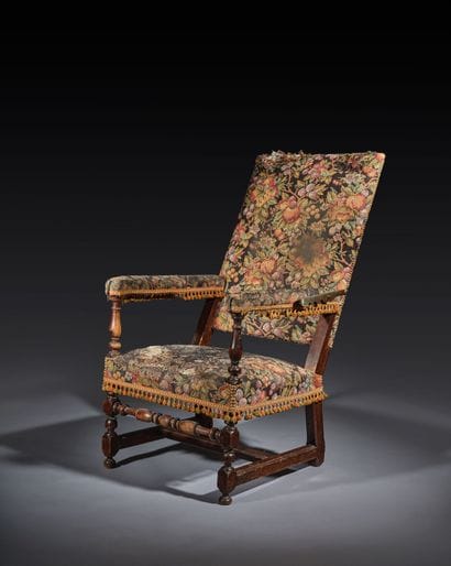 Stained walnut armchair with a reclining...