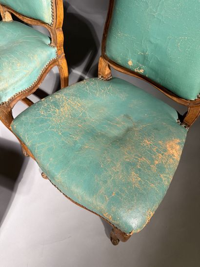 Four chairs in molded and carved beech, with...