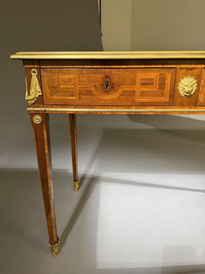 A small, flat desk made of rosewood and amaranth,...