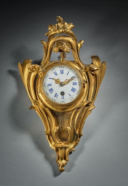 Gilded bronze alcove clock with foliage and...