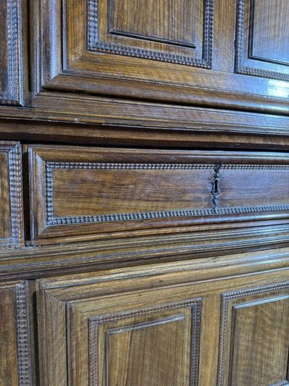Two-section walnut cabinet with four-panel...