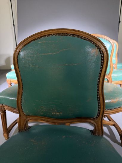 Ten chairs in molded beech with rounded backs,...