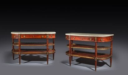 A pair of half-moon-shaped mahogany console...