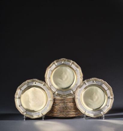 Set of twenty-four multi-lobed vermeil plates...