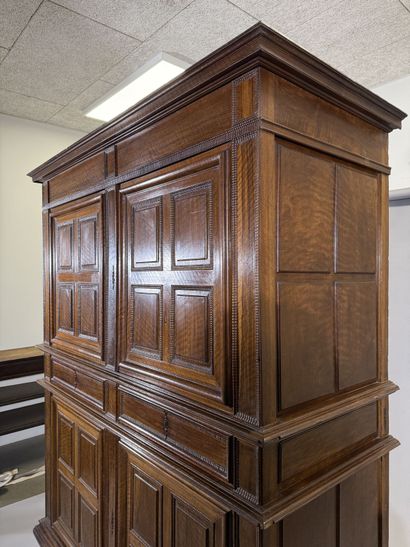 Two-section walnut cabinet with four-panel...