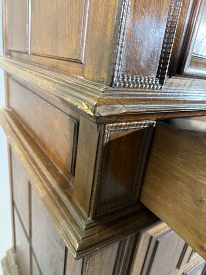 Two-section walnut cabinet with four-panel...