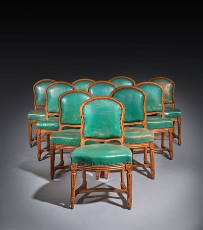 Ten chairs in molded beech with rounded backs,...